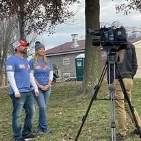 Hero Run organizers being interviewed by a local news crew