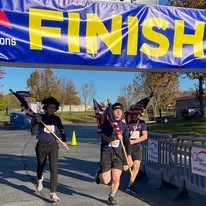 Runners finishing the race in costume