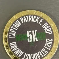 Close-up of the Hero Run 5K award medal