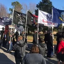Veterans holding flags together before the race
